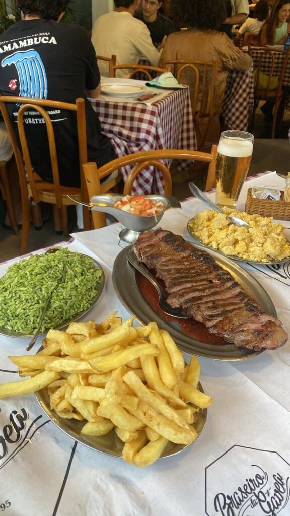 [I ate] Picanha steak with fries, broccoli rice, and farofa
