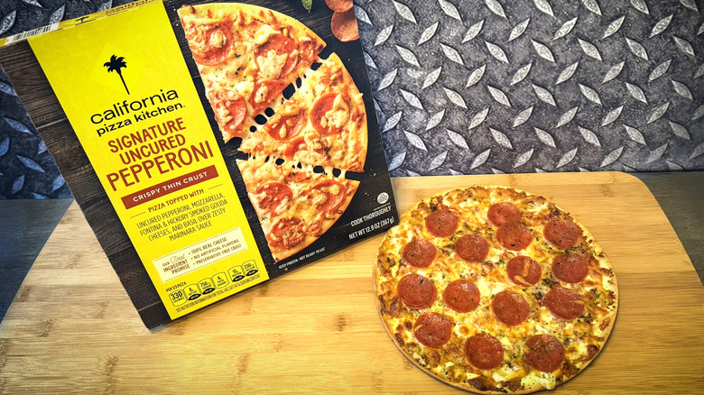 california pizza kitchen pepperoni pizza on cutting board with box