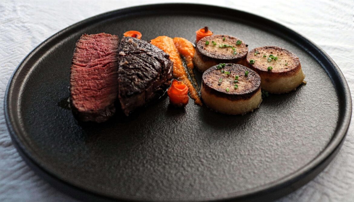 Filet mignon, carrot puree, carrot roses, fondant potatoes.