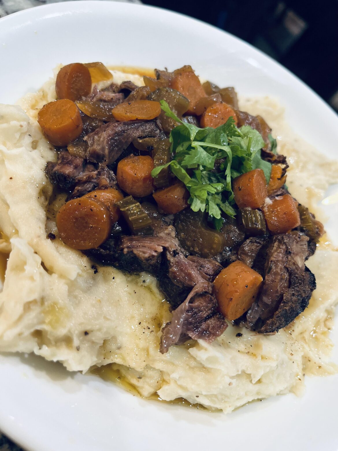 Simple pot roast over mashed potatoes Simple pot roast over mashed potatoes