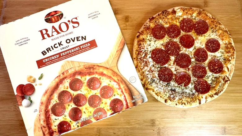 rao's uncured pepperoni pizza on cutting board with box