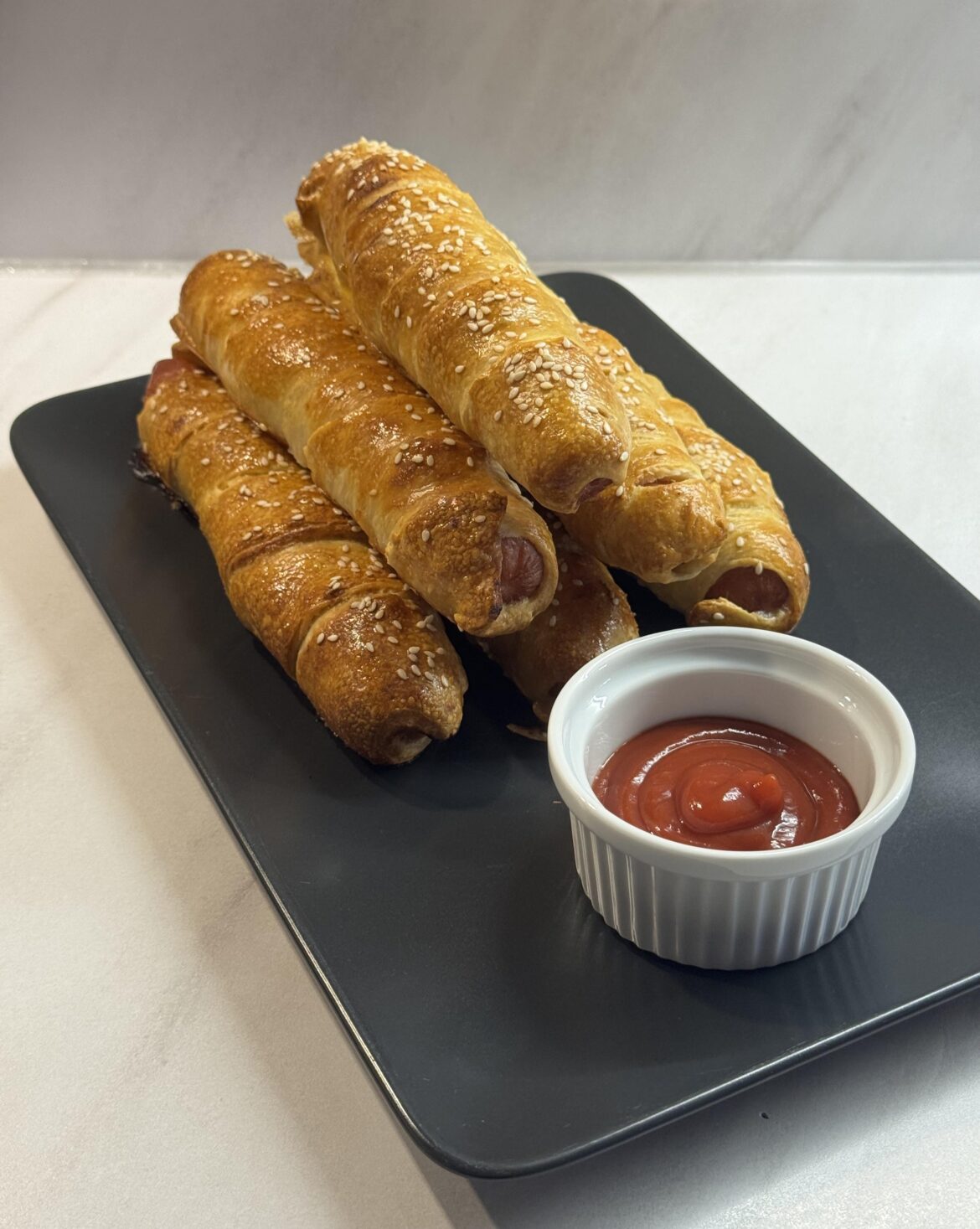 breakfast rolls with bacon-wrapped sausages