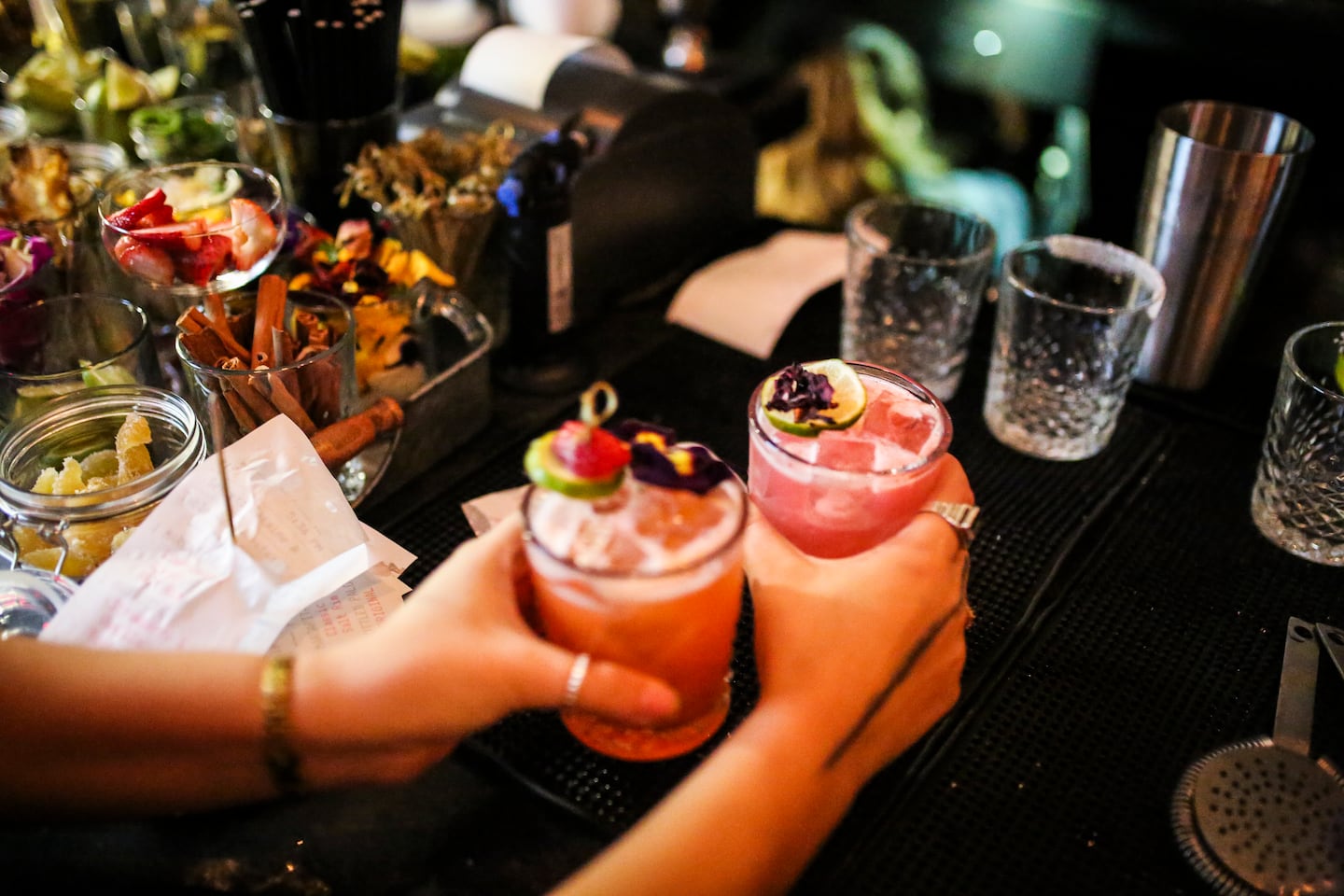 Finished cocktails are picked up to be delivered to their table at the Yellow Door Taqueria.