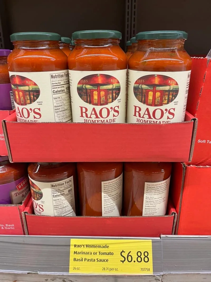 Jars of Rao's Homemade Marinara Sauce on a store shelf, priced at $6.88.
