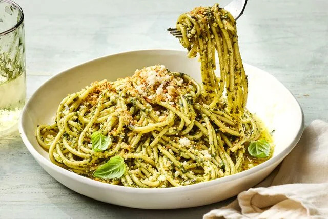 Food & Wine / Photo by Greg Dupree / Prop Styling by Josh Hoggle / Food Styling by Margaret Dickey Swapping in breadcrumbs for pine nuts gives pesto a toasty, buttery layer.