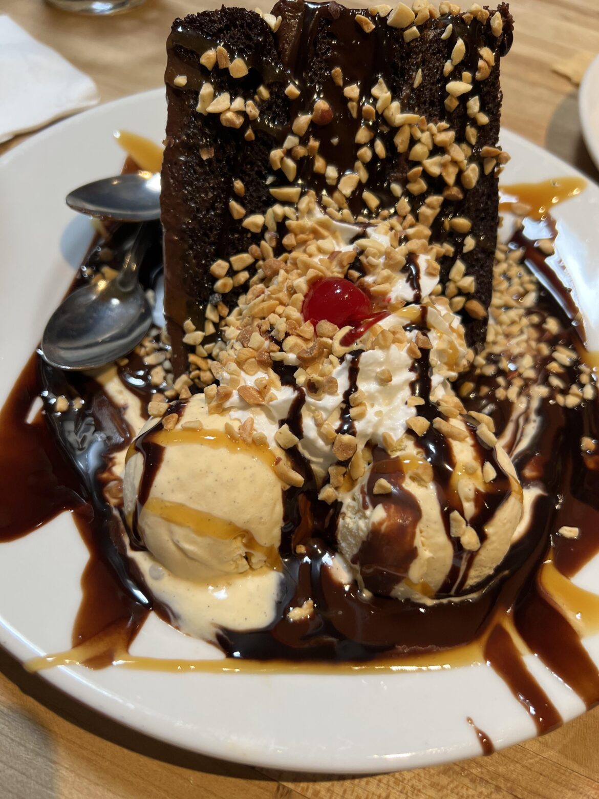 chocolate cake with vanilla ice cream, caramel syrup, nuts, & hot fudge. basic, but sooo yummy