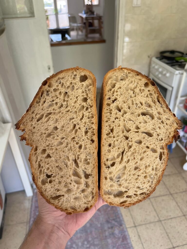 i didn't take pics of the bread before slicing it, but this is my best crumb so far