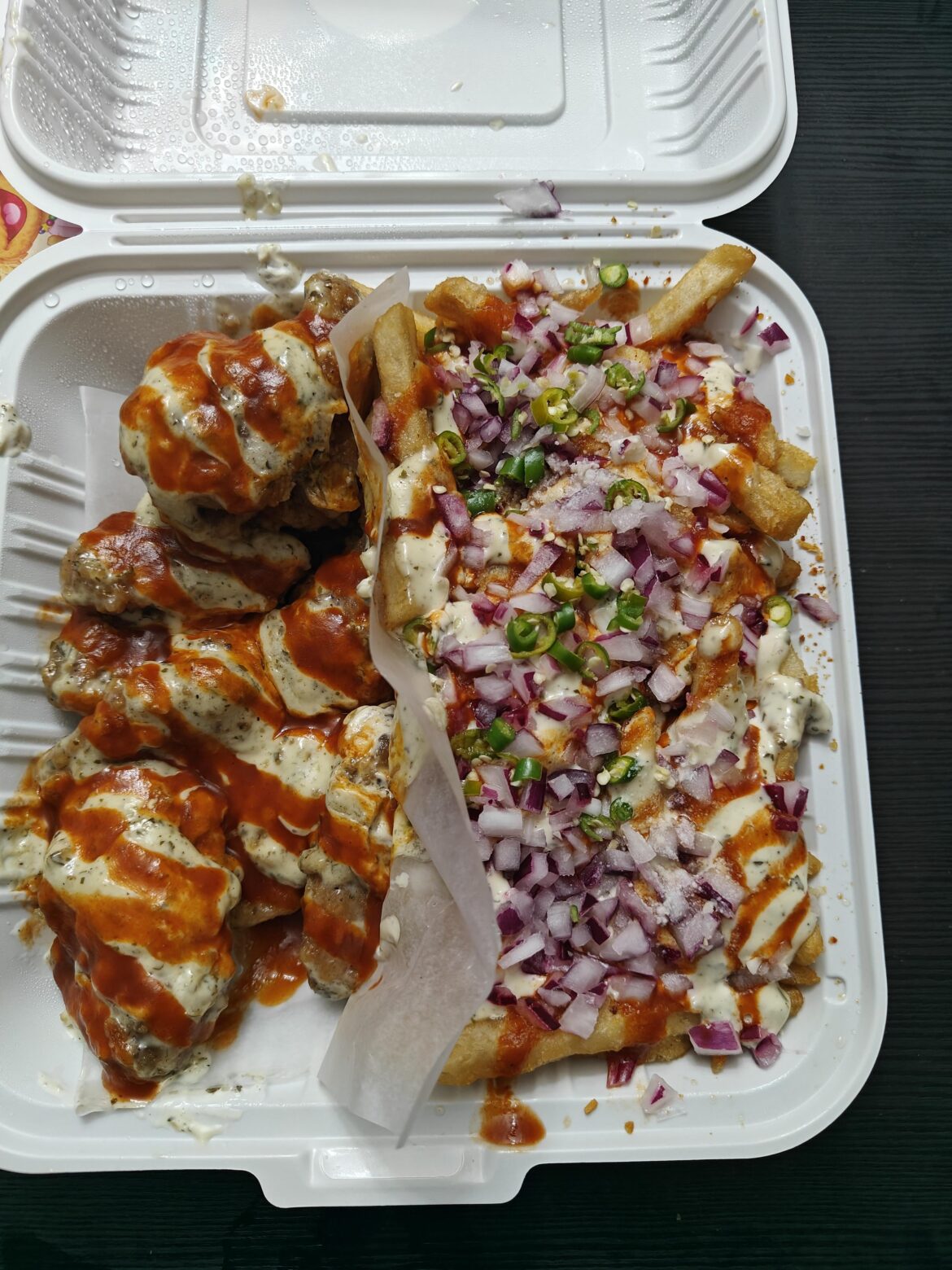 Sweet and spicy wings with chili onion fries. Toronto