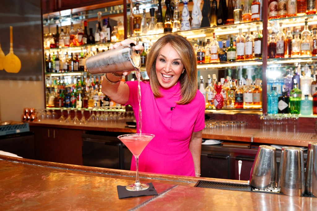 Rosanna Scotto making a cocktail behind a bar.