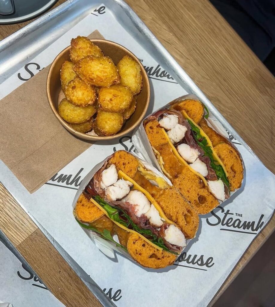 Calories in this bagel and tater tots? It had grilled chicken, cheese, smoked bacon and bbq sauce in a cheese bagel