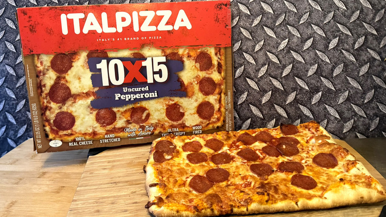 italpizza pepperoni pizza on cutting board with box