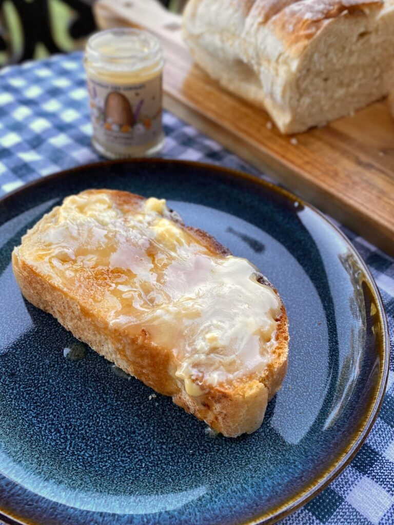 Sourdough toast spread with salted butter and local whipped honey
