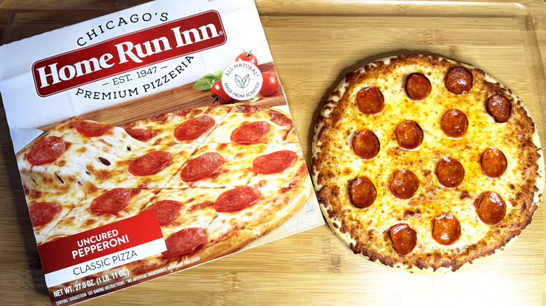 home run inn pepperoni pizza on cutting board with box
