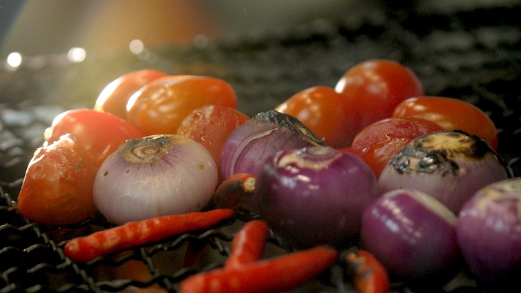 Ingredients such as burnt shallots and burnt tomatoes lend an alluring smokiness to the dish.