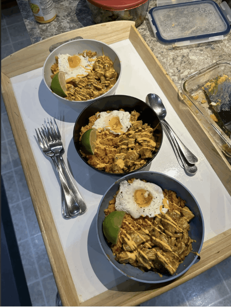 Made this for my little brother and his friends, yellow rice topped with egg, creamy chicken, lime and spicy mayo