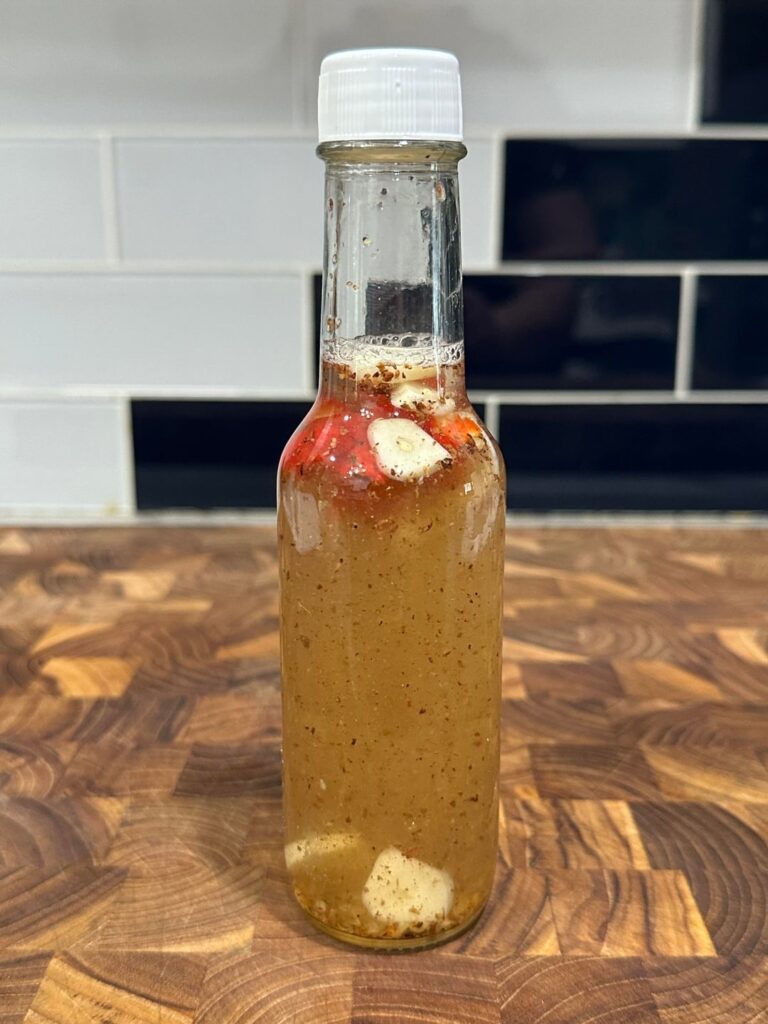 yesterday i cut up my single homegrown reaper and put it in vinegar. today i added stuff.