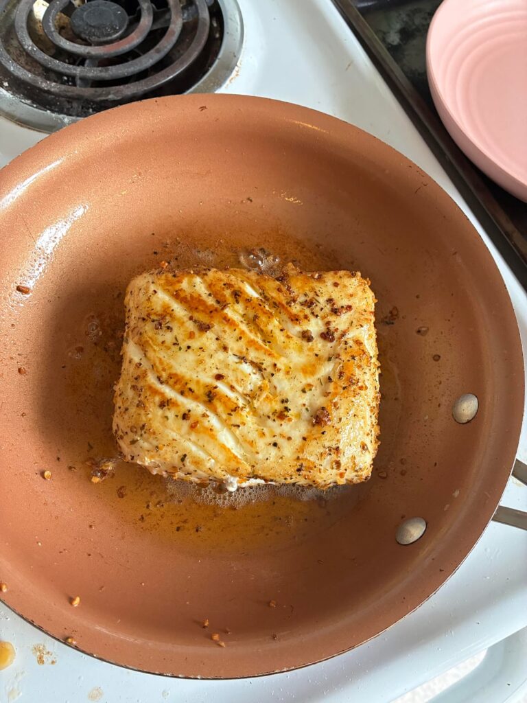 Pan seared Alaskan halibut in a lemon butter cream sauce[homemade]