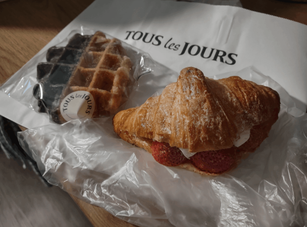 Chocolate dipped Belgian and croissant with strawberrys and cream