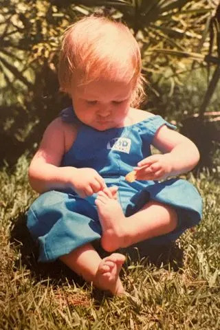 Asha Dore Writer Asha Dore eating kumquats as a baby