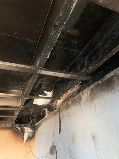 Fire damage in one of the structures at Camp Nedooae.