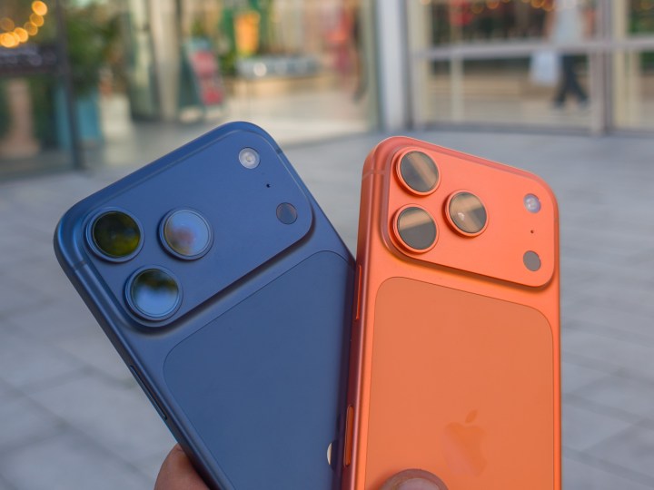 Apple iPhone 17 Pro in Cosmic Orange next to the iPhone 17 Pro Max in Deep Blue