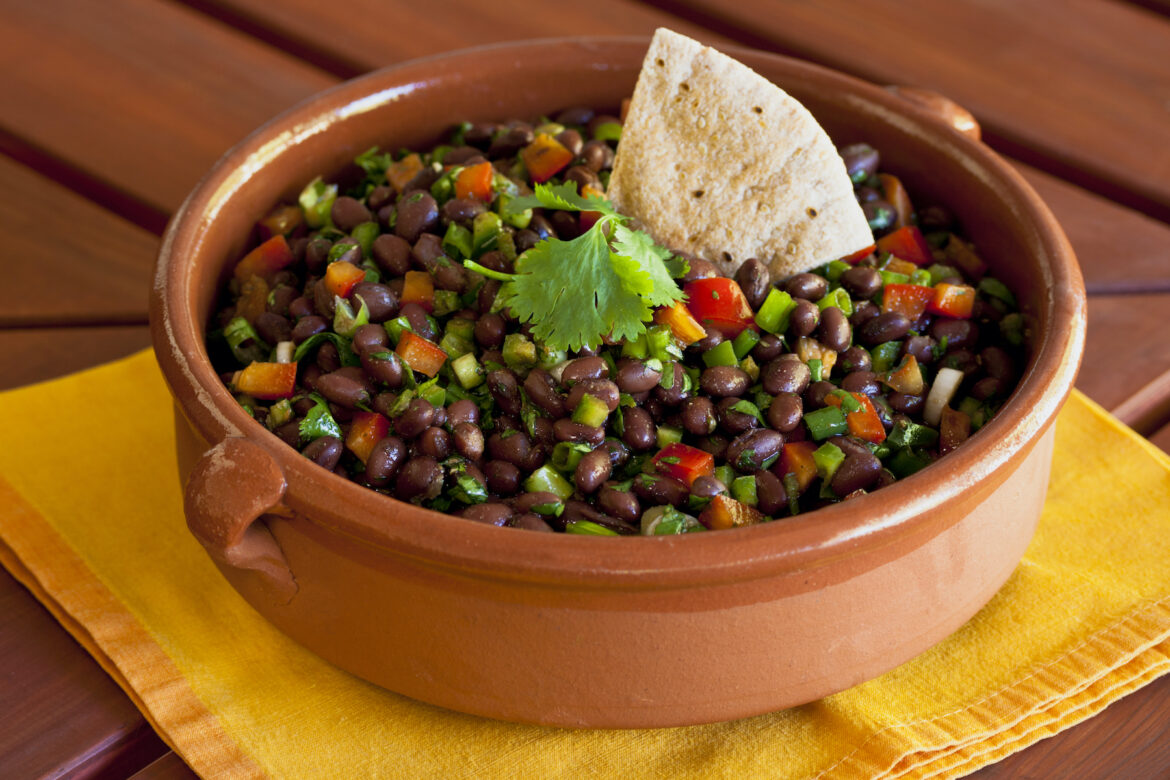 The black bean salad that saves me Black bean salad in an earthen ceramic bowl. (SharonFoelz/Getty Images)
