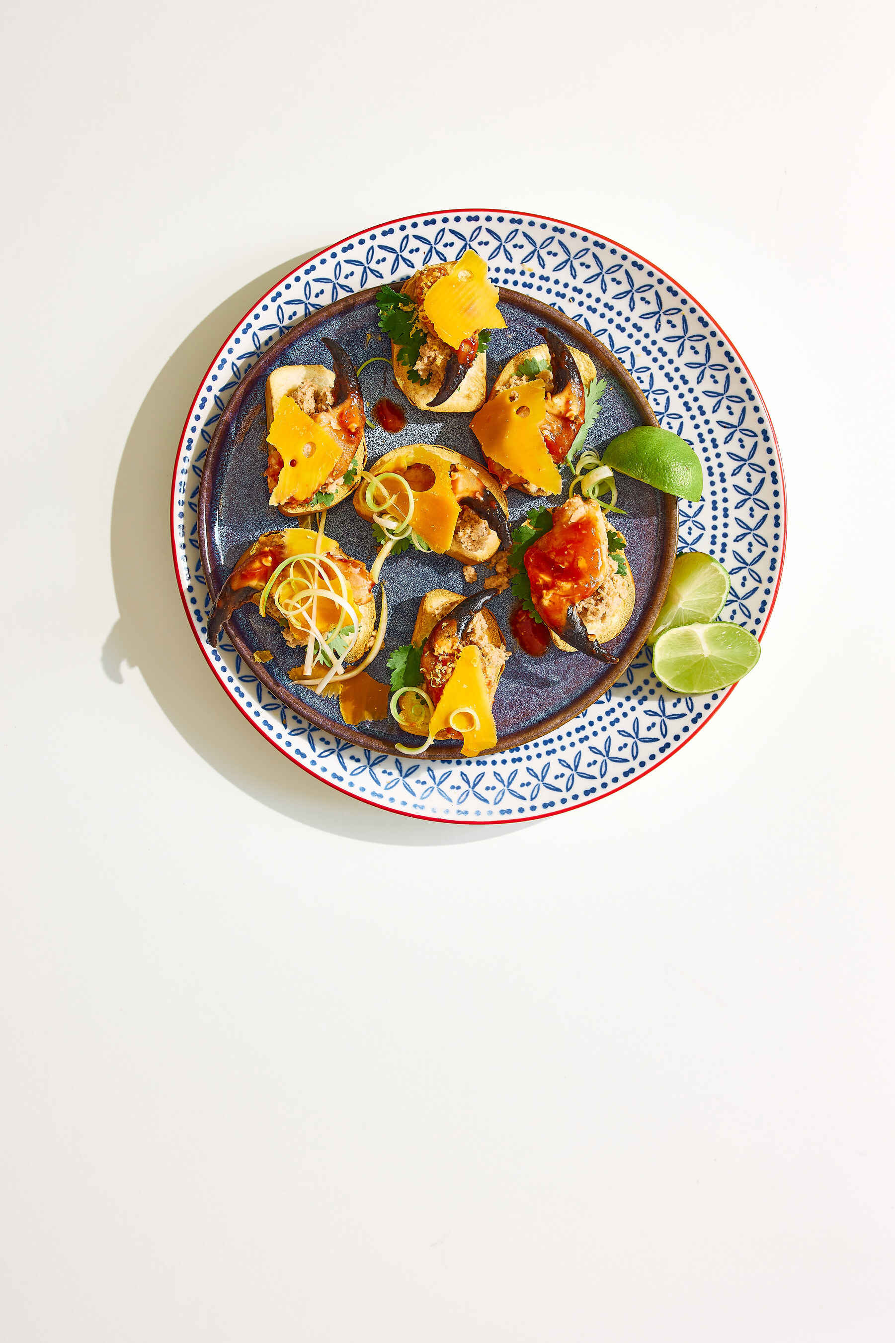Spice meets sophistication: Chilli Crab Toasts topped with rich French Mimolette — where bold heat and nutty cheese melt into every bite.