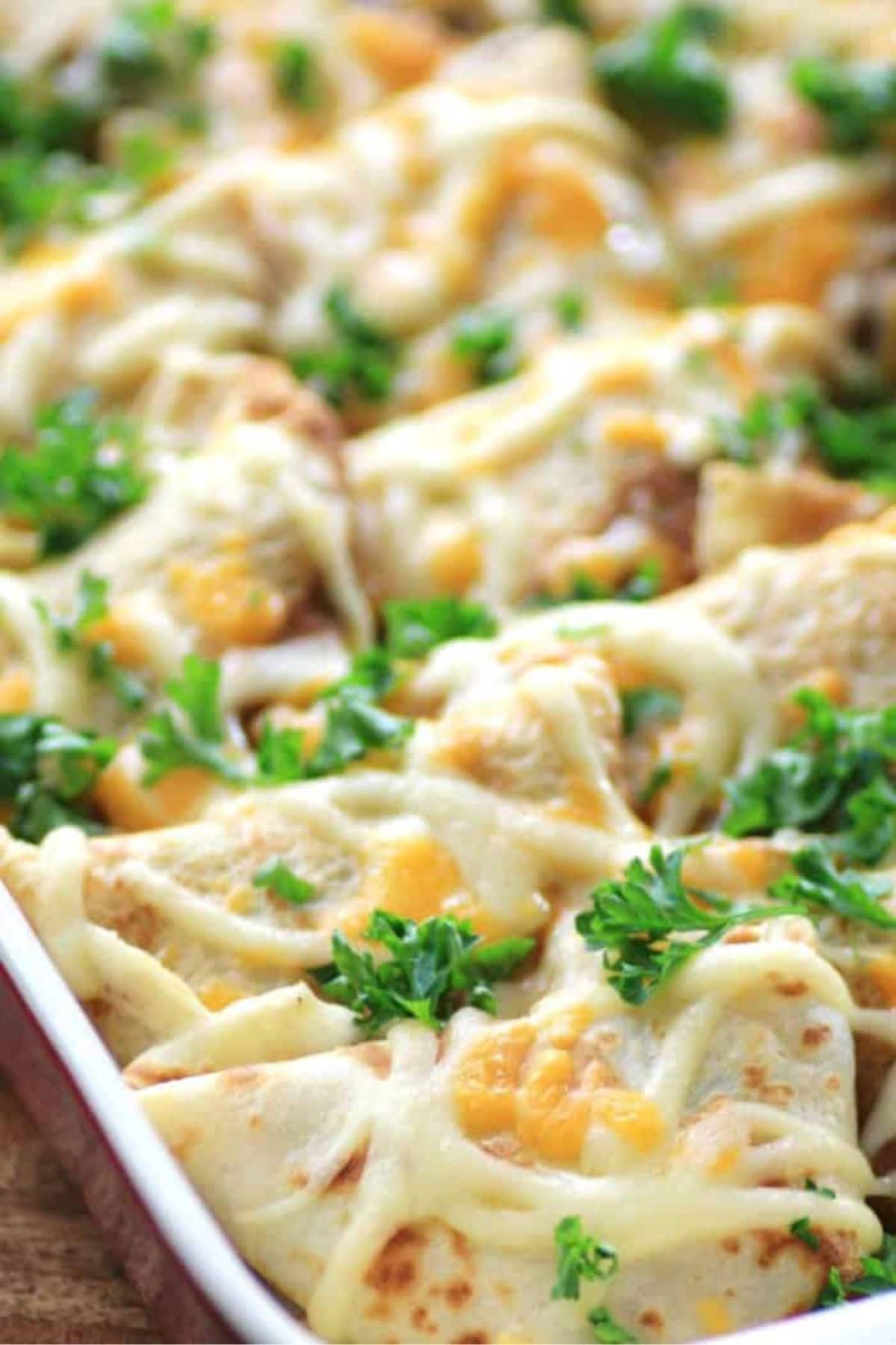 These 35 Scrumptious Make Ahead Brunch Casseroles will make your life over the holidays so much easier. Plus, everyone will be delighted with any one of these casseroles for the holidays. Crepes lorraine in baking dish.