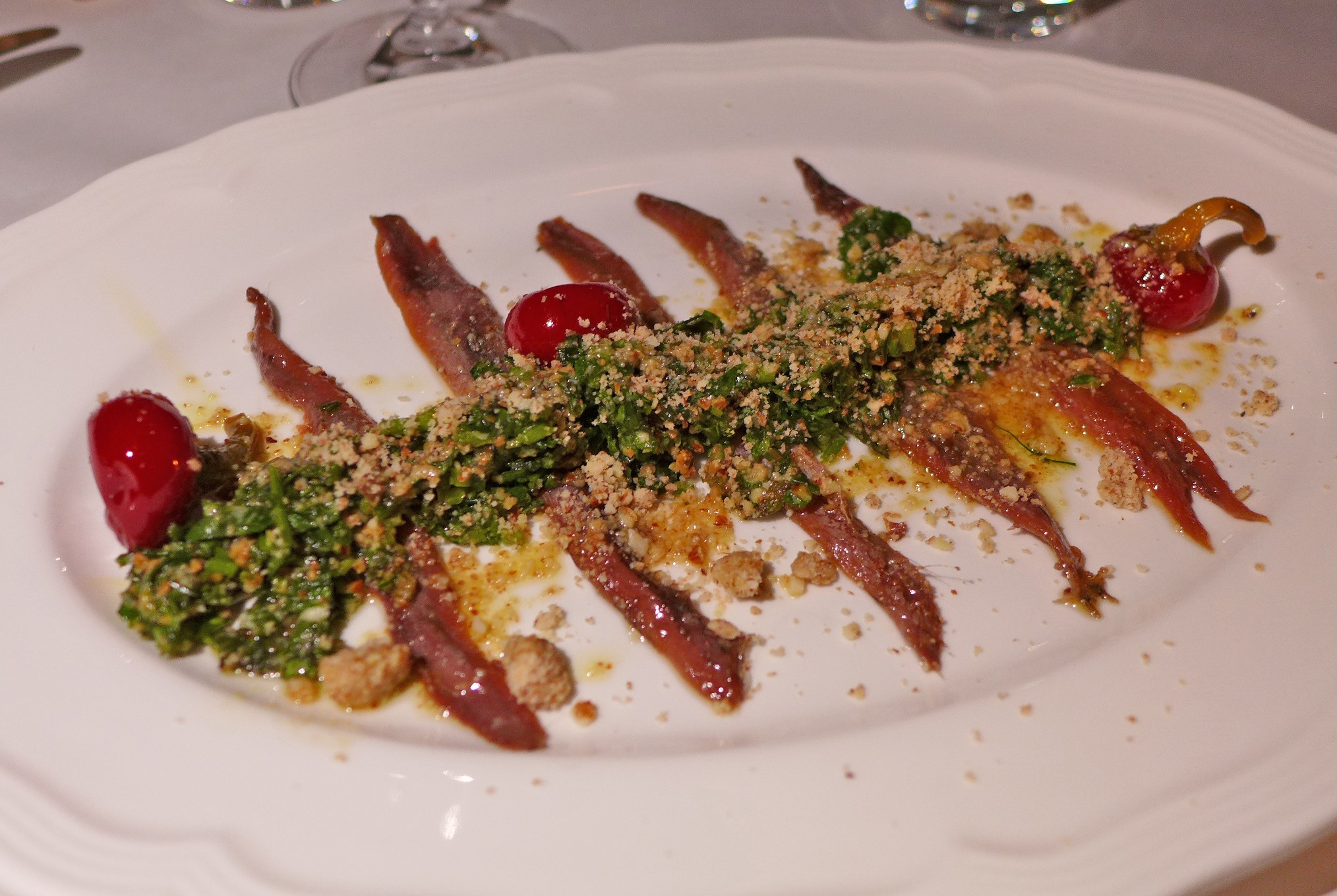 Tiny fish filets laid out in a rib cage formation.