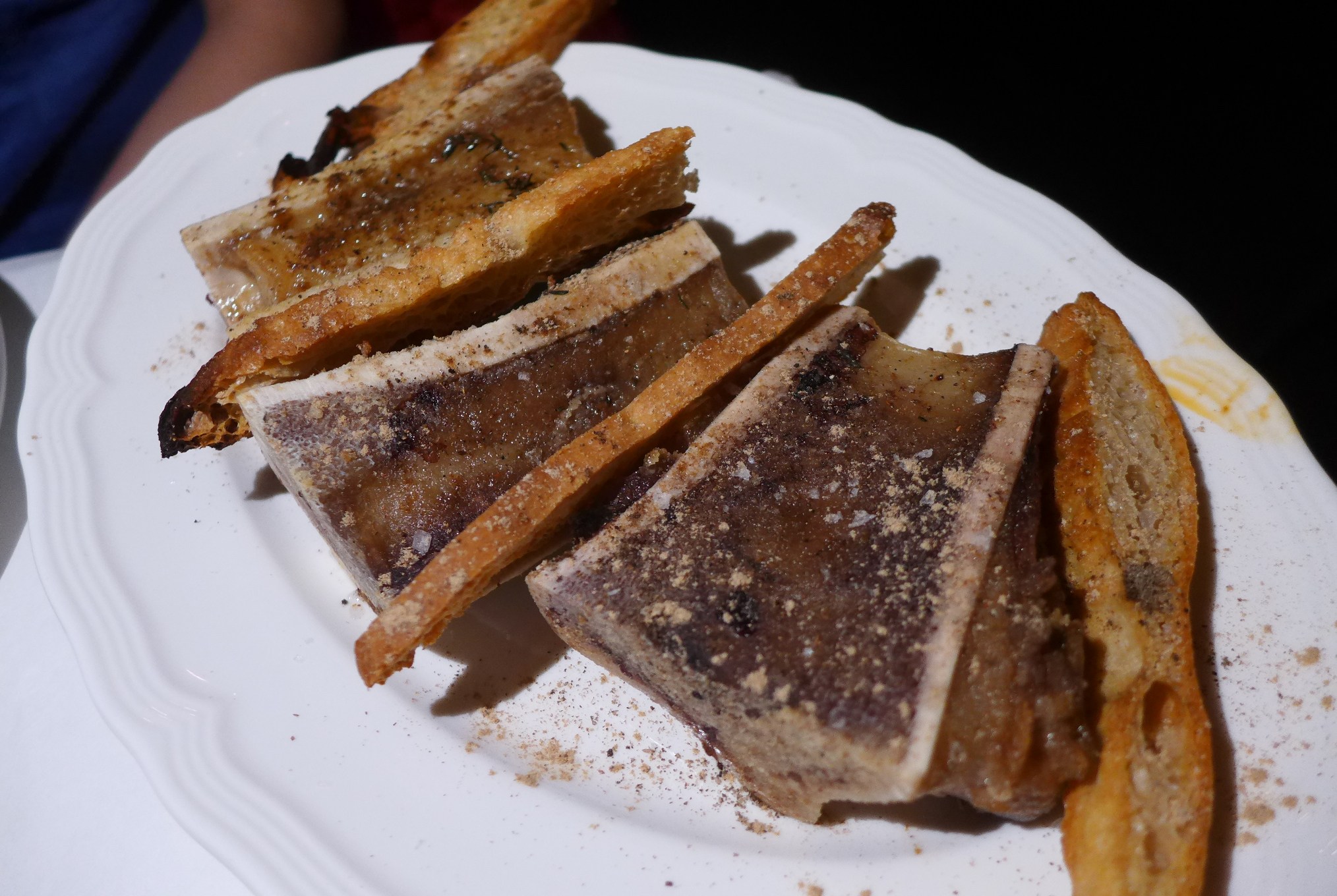 Three marrow bones split and roasted.