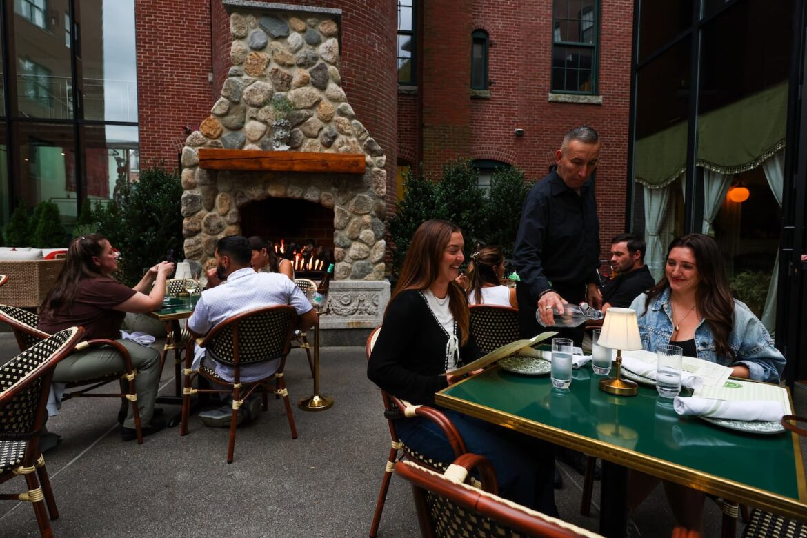 People dine on the patio at Capri in SoWa.