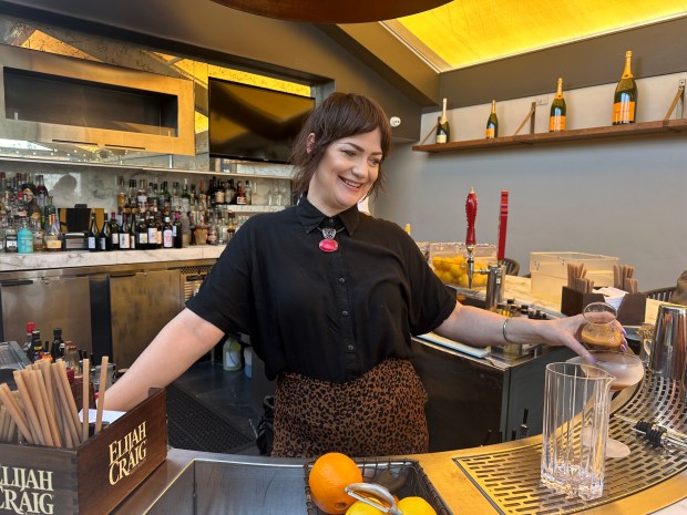Jocelyn Jolley, the head bartender at Michael’s on Naples, makes...