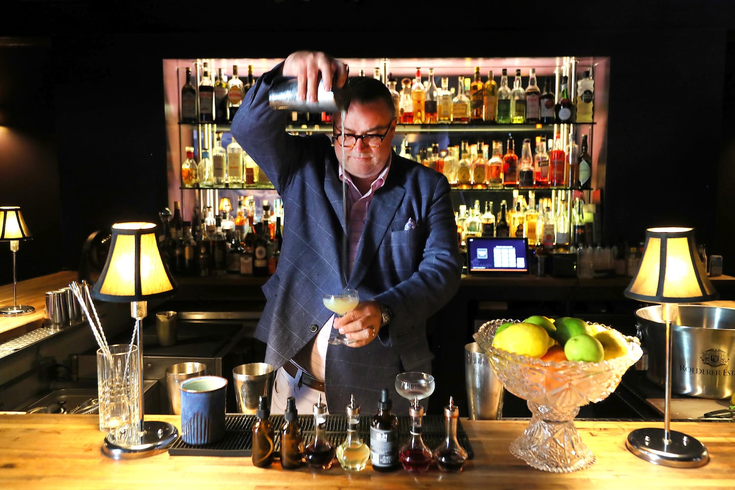 Michael Lester pours a daiquiri in the hotel's Bar, which he will also oversee at Neptune.