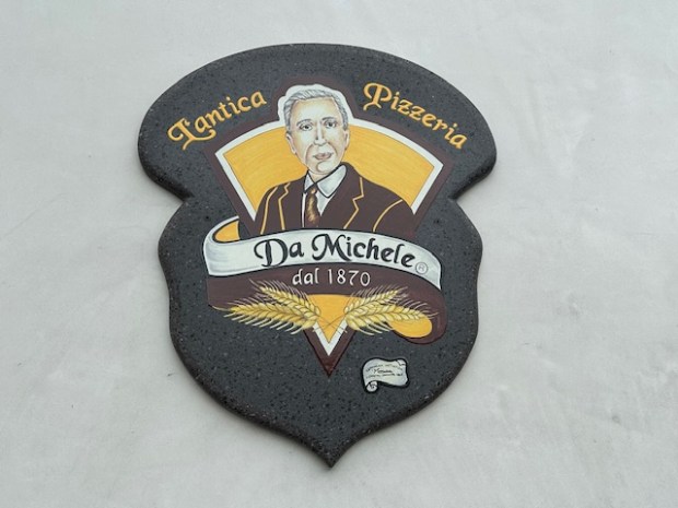 This emblem is part of the decor at L’antica Pizzeria...