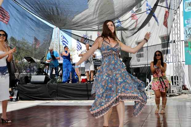Attendees dance to a live band at the Long Beach...