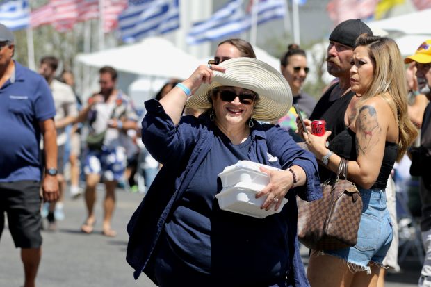 Attendees stroll through the Long Beach Greek Festival on Sunday,...