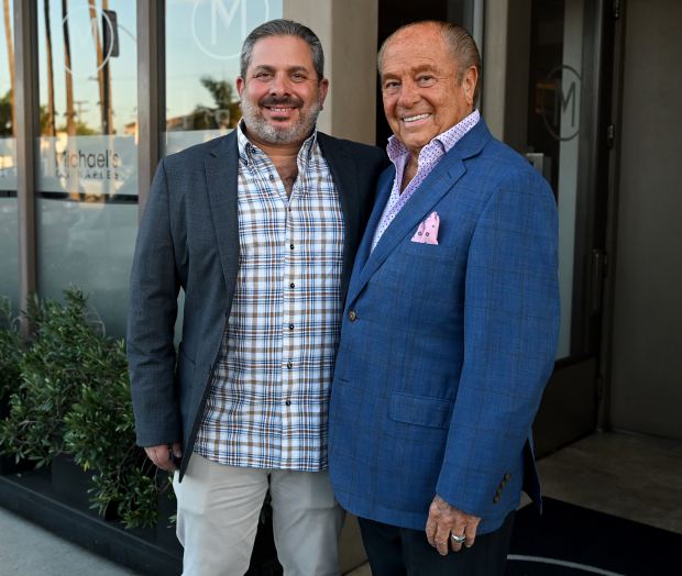 Carl Dene, left, and Michael Dene, right, owners pose for...