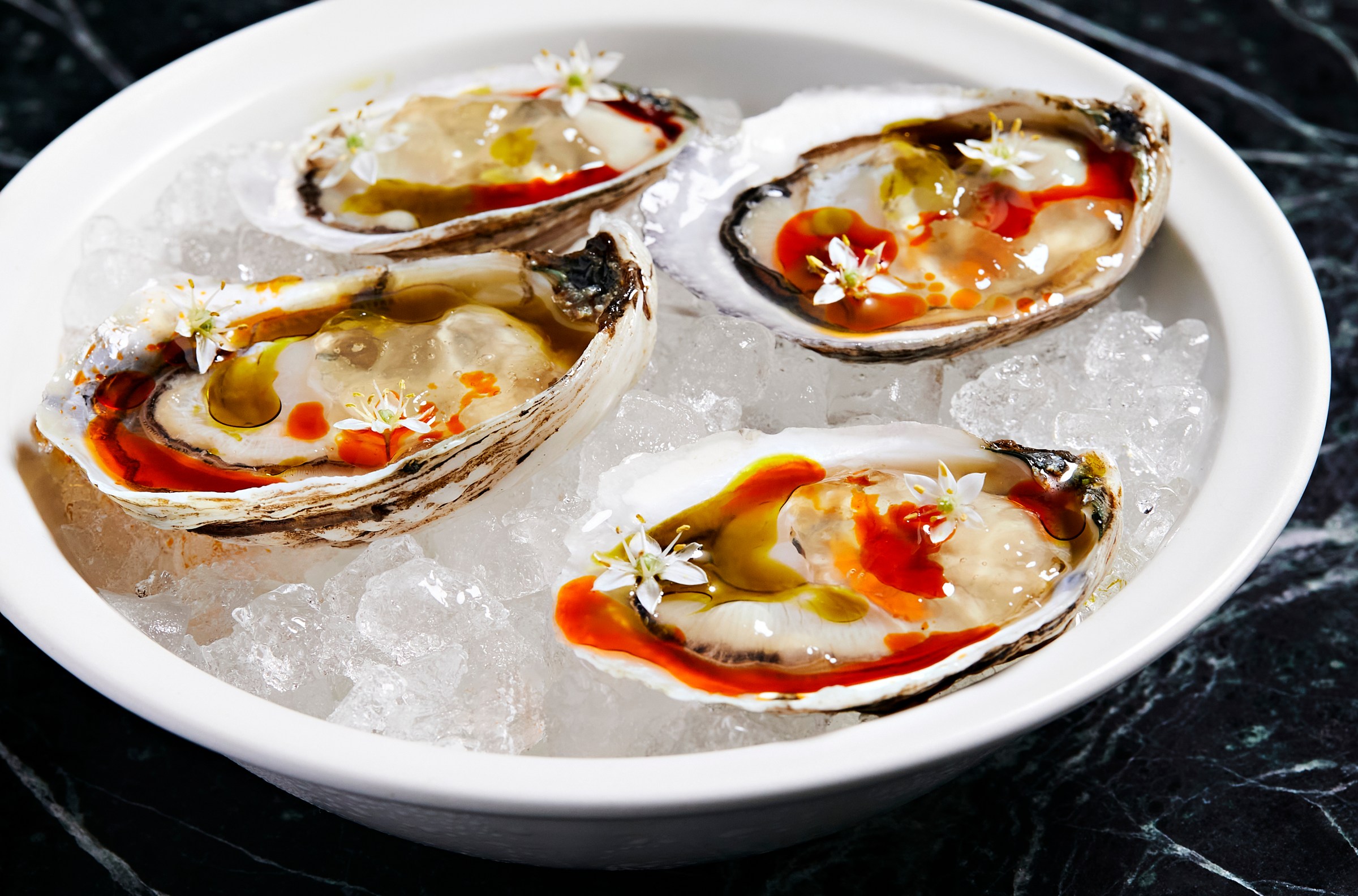 Oysters dressed with clarified coconut curry.