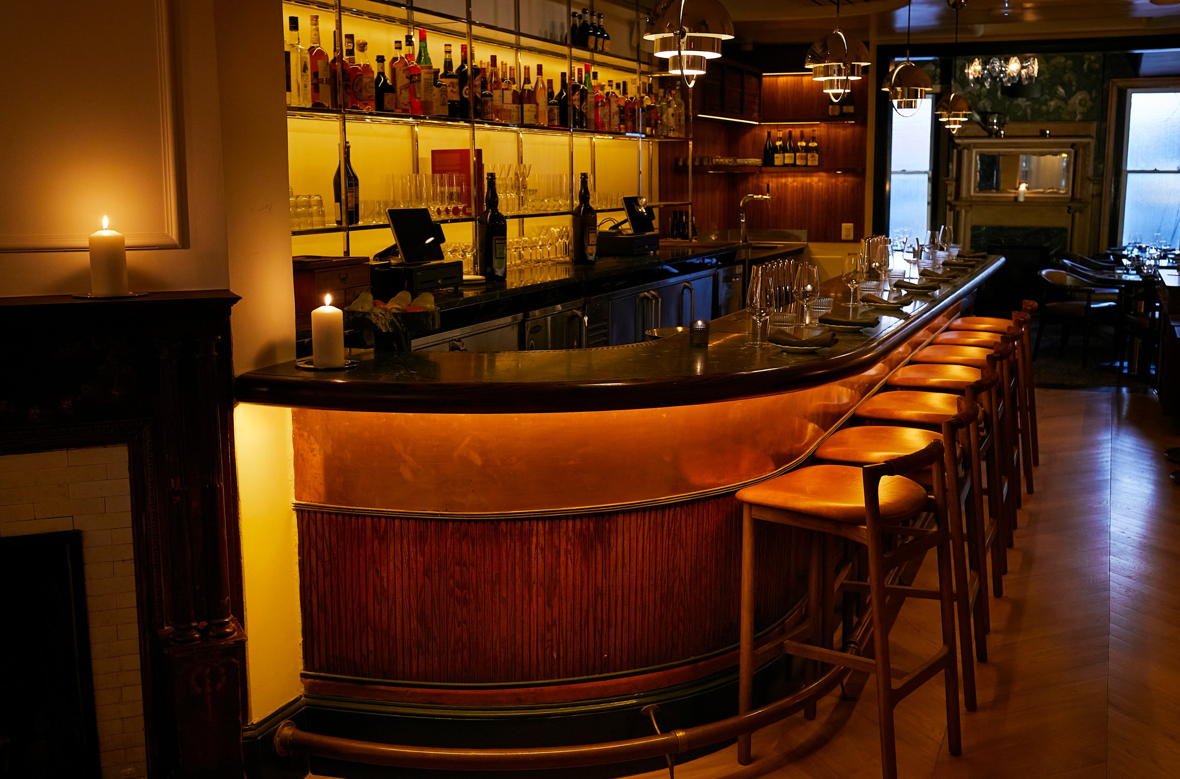 The dreamy bar at Maison welcomes guests upon entry.