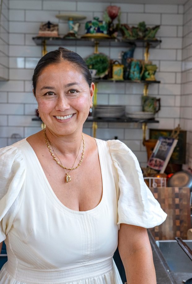 Home cook and influencer Corre Larkin stands in her kitchen...