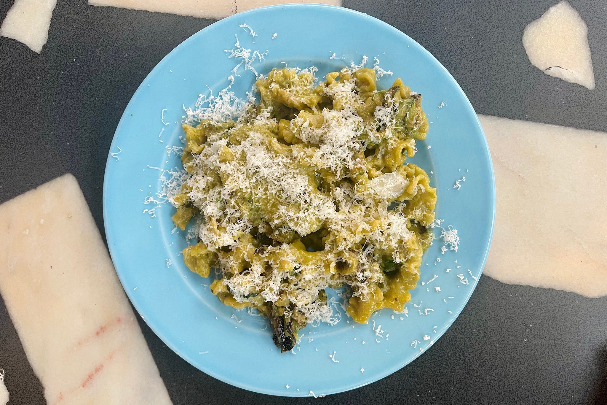 Slow-cooked courgettes and herbs transform pasta shells into a bowl of summer memories