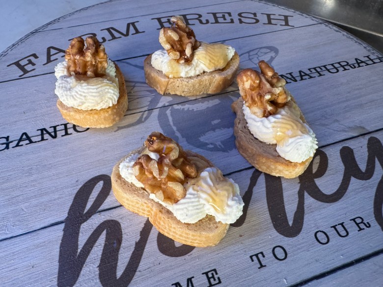 Walnut and ricotta crostini. Photo by Robert Eliason.