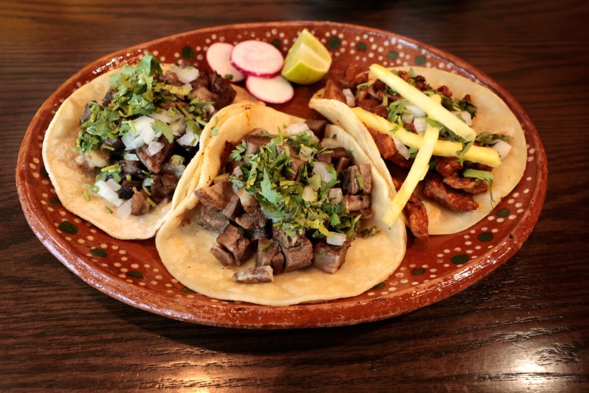 A plate of tacos — cabeza, lengua, and al pastor — at the new Orient Heights branch of longtime East Boston favorite Taqueria Jalisco.