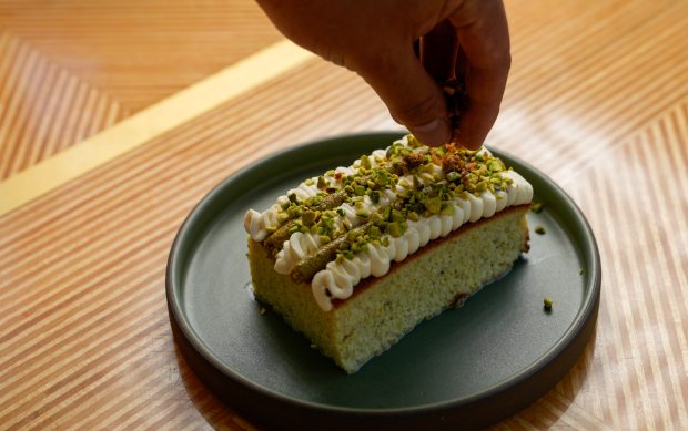 The finished Pistachio Tres Leches Cake is topped with passion...