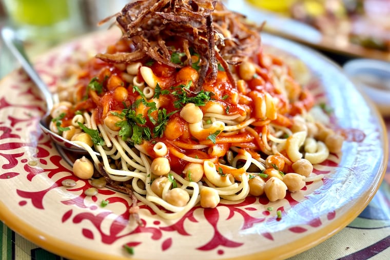 The best things we ate this week at Cilantro Mediterranean Cuisine, Middle Child PHL, and Mahalo Hawaiian BBQ Koshary, a classic Egyptian dish that combines multiple shapes of pasta with rice, lentils, chickpeas, crunchy fried onions and spiced tomato sauce, at Cilantro Meditrranean Cuisine.
