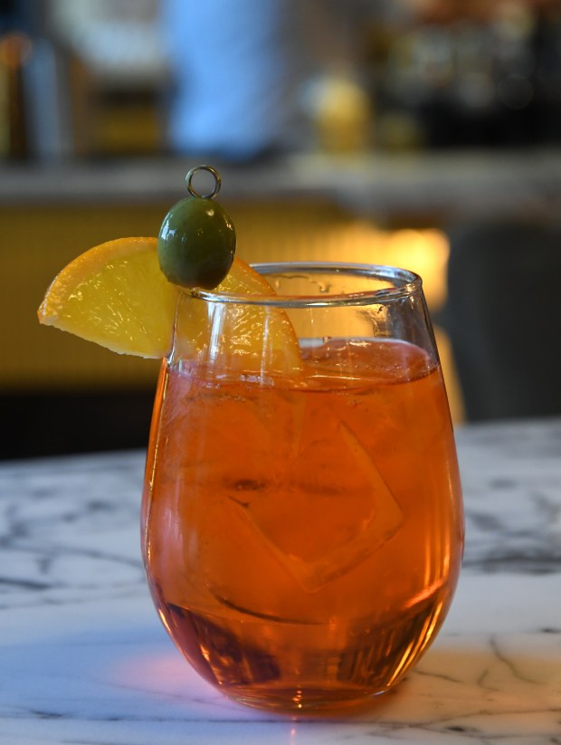 Chief Culinary Officer Max MacKissock and the staff at Bar Amorina prepare to open their new restaurant soon at 233 Clayton St. on Jan. 3, 2025 in Denver. A popular drink at the bar is the Aperol Spritz. (Photo By Kathryn Scott/Special to The Denver Post)