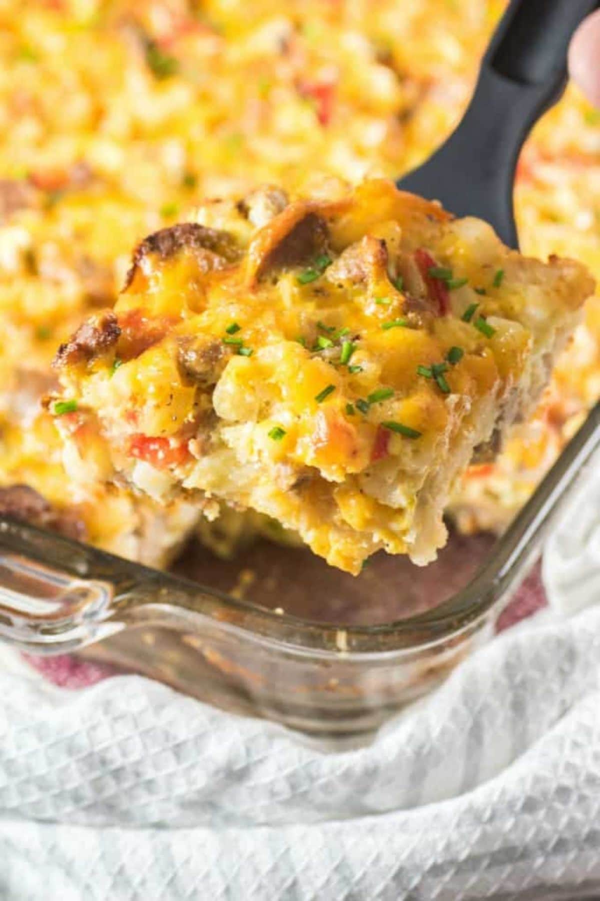 These 35 Scrumptious Make Ahead Brunch Casseroles will make your life over the holidays so much easier. Plus, everyone will be delighted with any one of these casseroles for the holidays. Hashbrown casserole in baking pan.