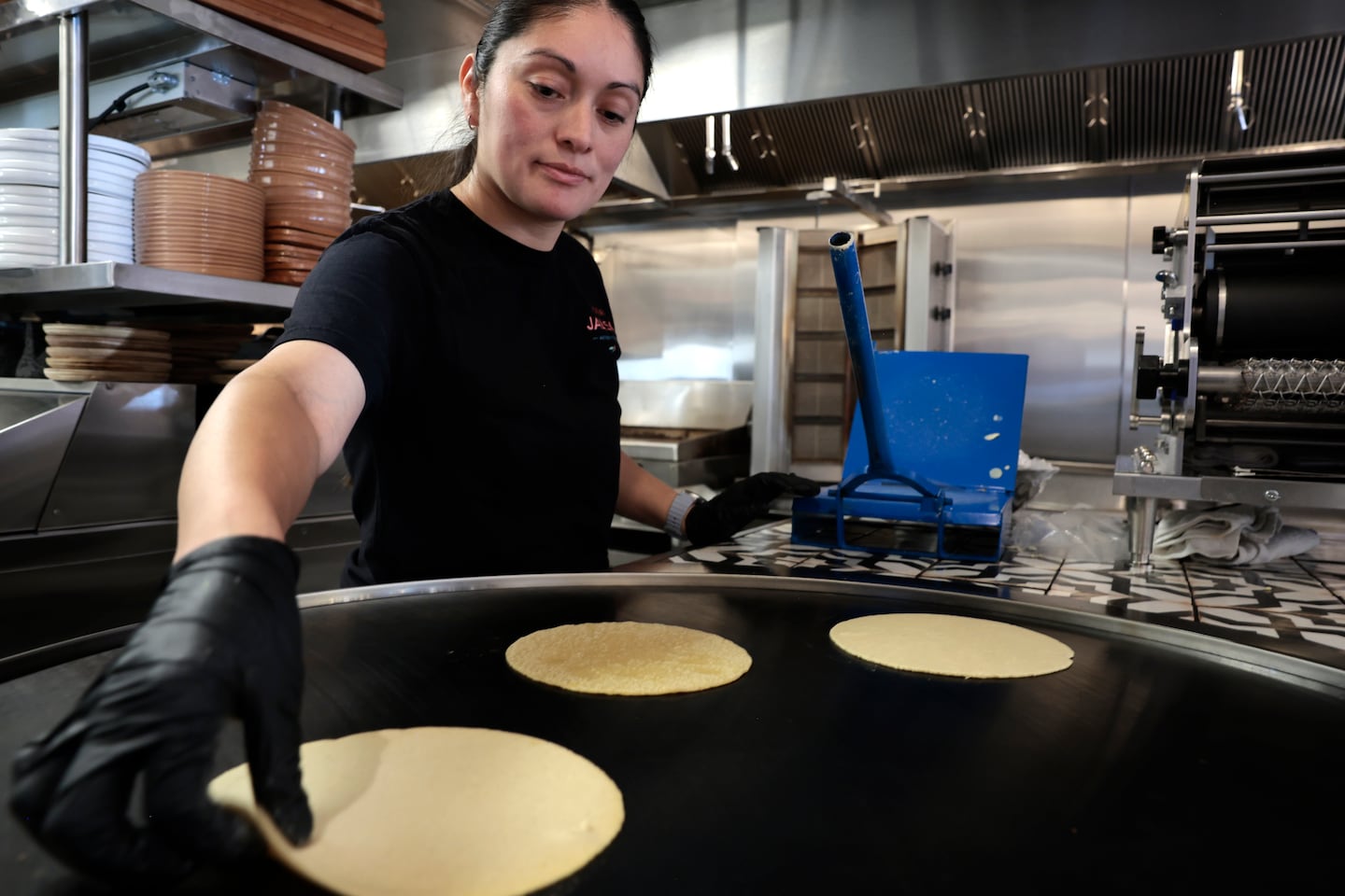 Greis Garcia makes tortillas at Taqueria Jalisco in the Orient Heights neighborhood of East Boston.