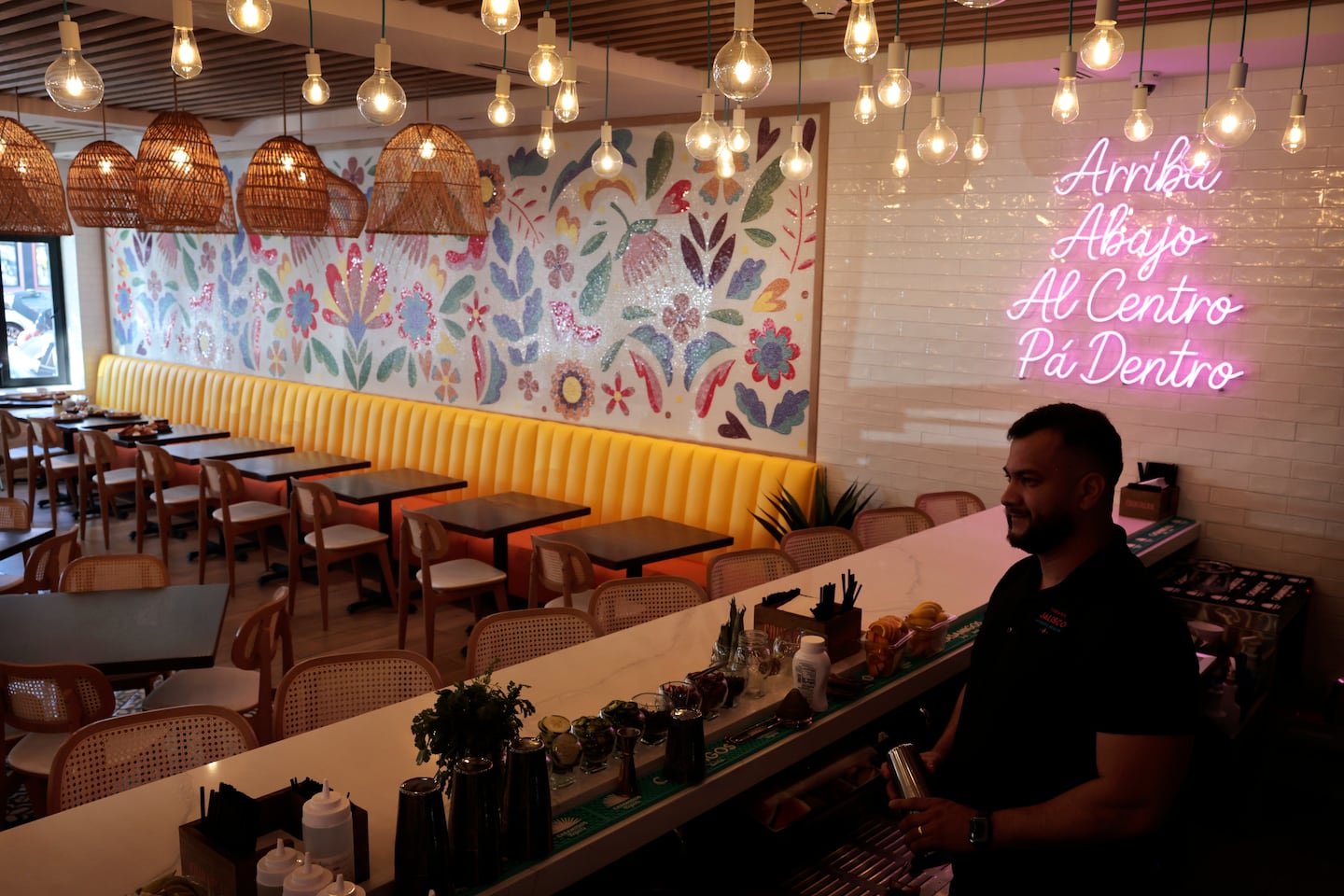 Alberto Salinas tends bar at Taqueria Jalisco, where you can get your margarita garnished with a house-made popsicle.