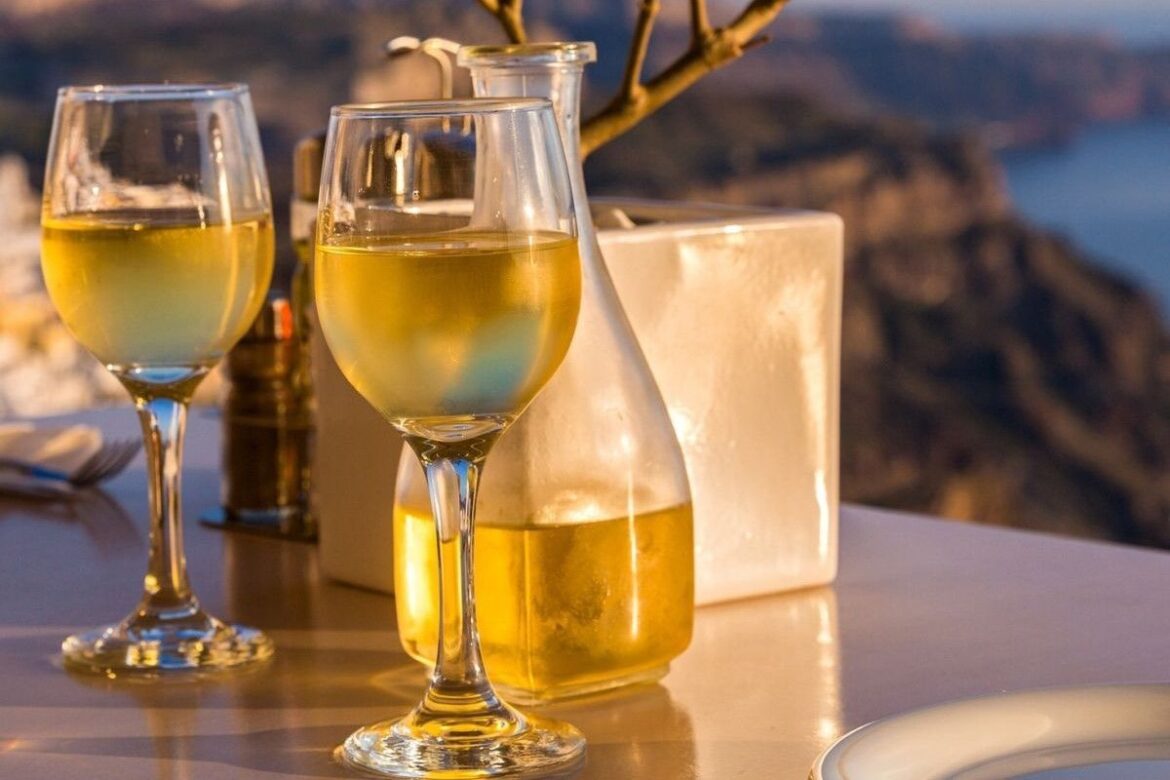 Romantic table for two on the island Santorini, Greece. Views of the sea and the volcano